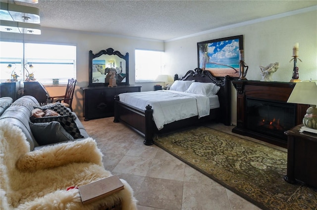 bedroom with ornamental molding and a textured ceiling