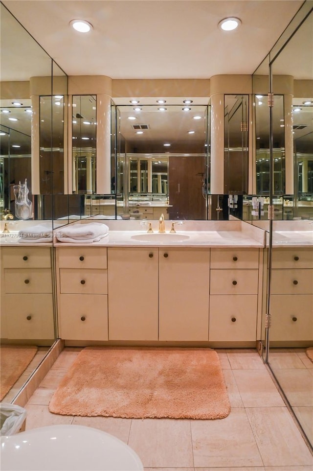 bathroom featuring vanity and tile patterned flooring