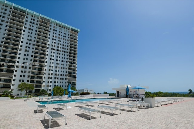 view of swimming pool featuring a patio