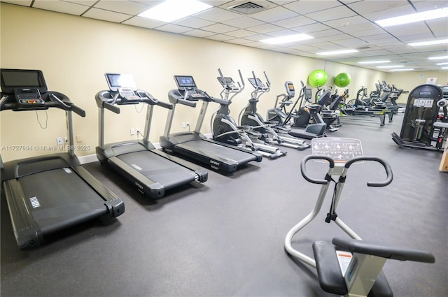 exercise room with a drop ceiling