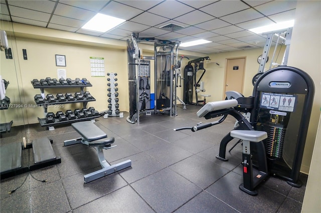 workout area featuring a paneled ceiling