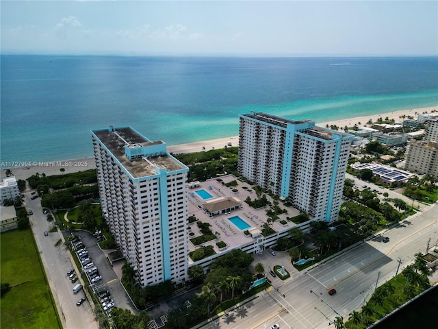 bird's eye view featuring a water view and a view of the beach