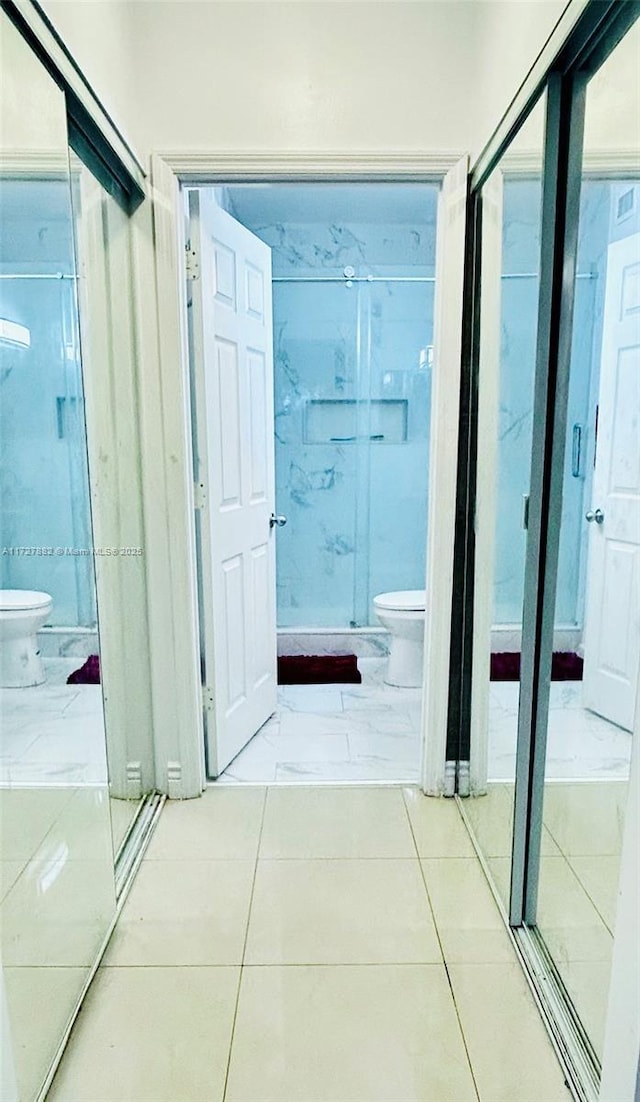 corridor with light tile patterned floors