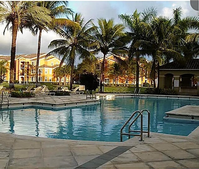 view of swimming pool with a patio area