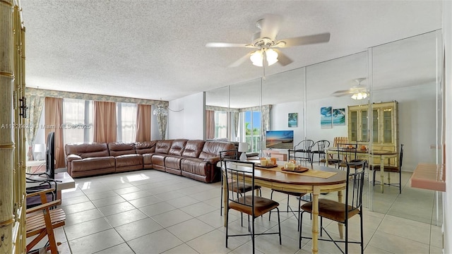 dining room with ceiling fan, light tile patterned floors, and plenty of natural light