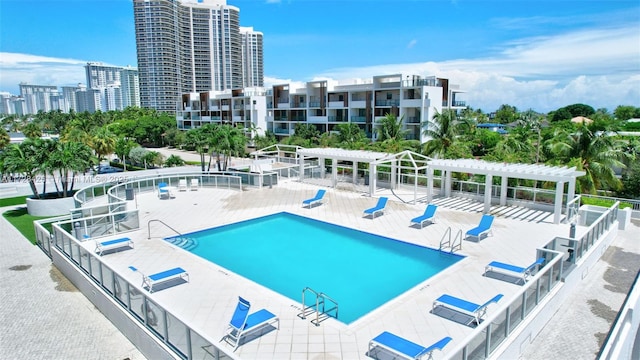 view of swimming pool featuring a patio and a pergola