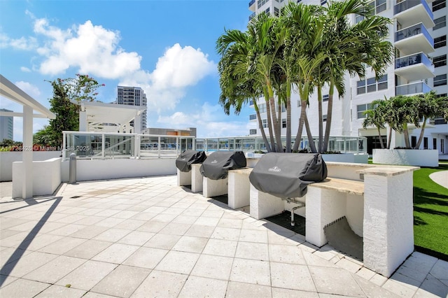 view of patio featuring a grill