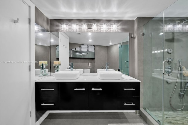 bathroom featuring walk in shower and vanity