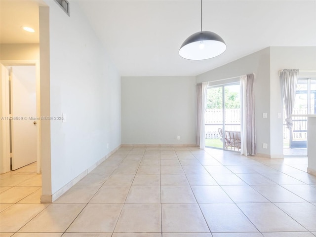 tiled spare room featuring a wealth of natural light