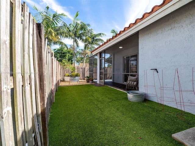 view of yard featuring a sunroom