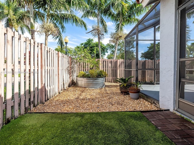 view of yard with a lanai