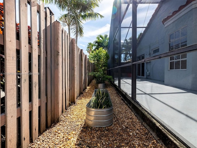 exterior space featuring a lanai and a patio area