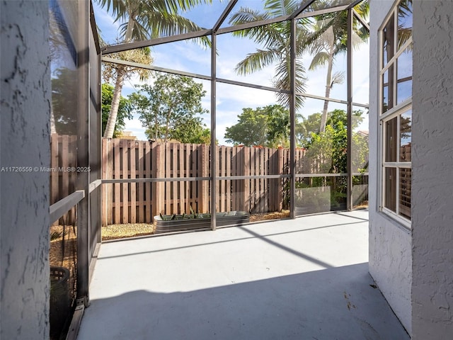 unfurnished sunroom featuring plenty of natural light