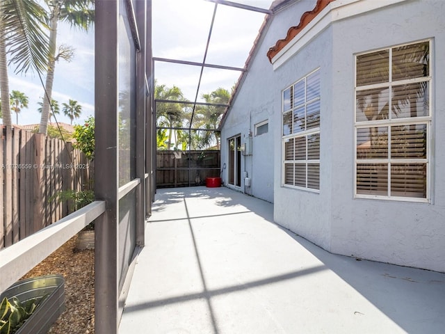 unfurnished sunroom featuring vaulted ceiling