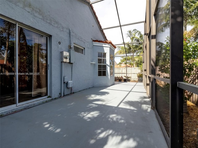 unfurnished sunroom featuring a skylight