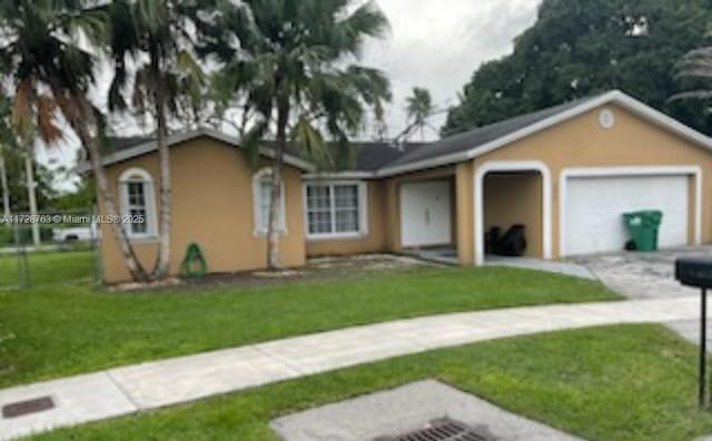 ranch-style house with a front yard and a garage