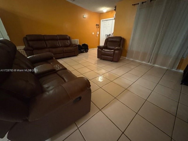 living room with light tile patterned floors