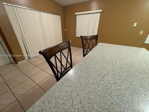 staircase with tile patterned flooring