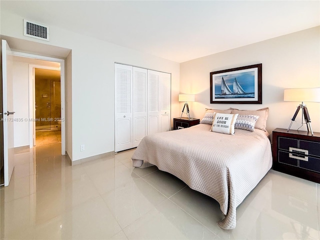 tiled bedroom with a closet