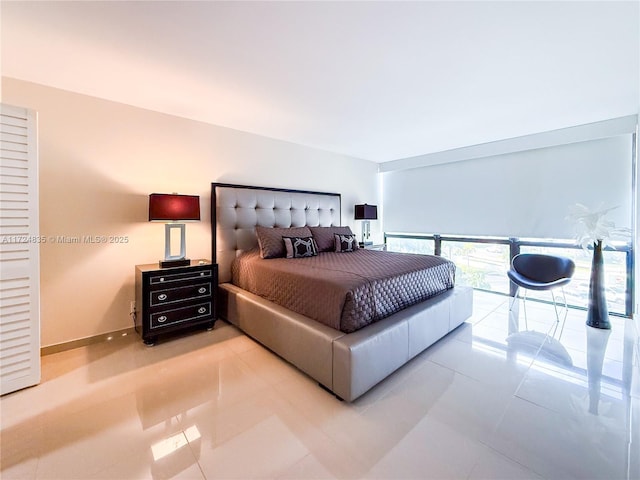 bedroom with light tile patterned floors