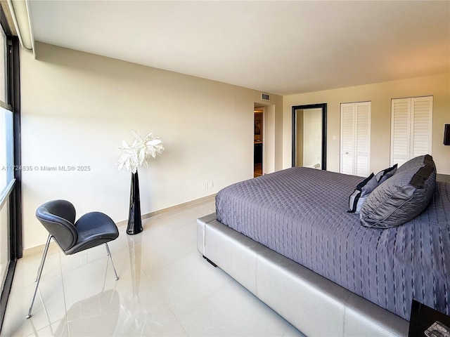 tiled bedroom with two closets