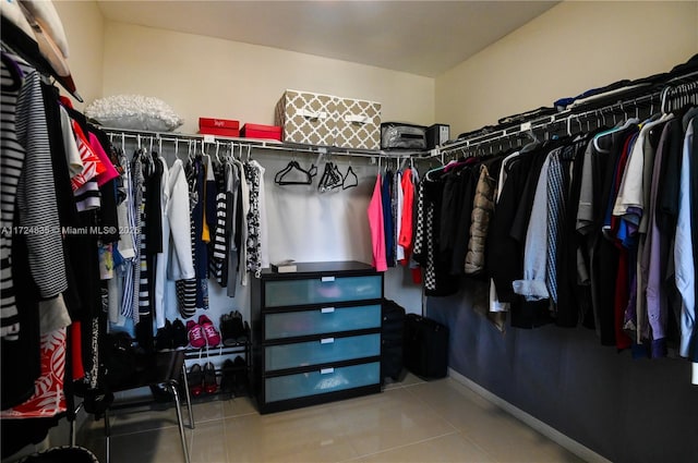 spacious closet featuring tile patterned floors