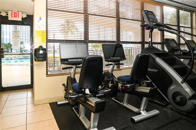 workout area with tile patterned floors