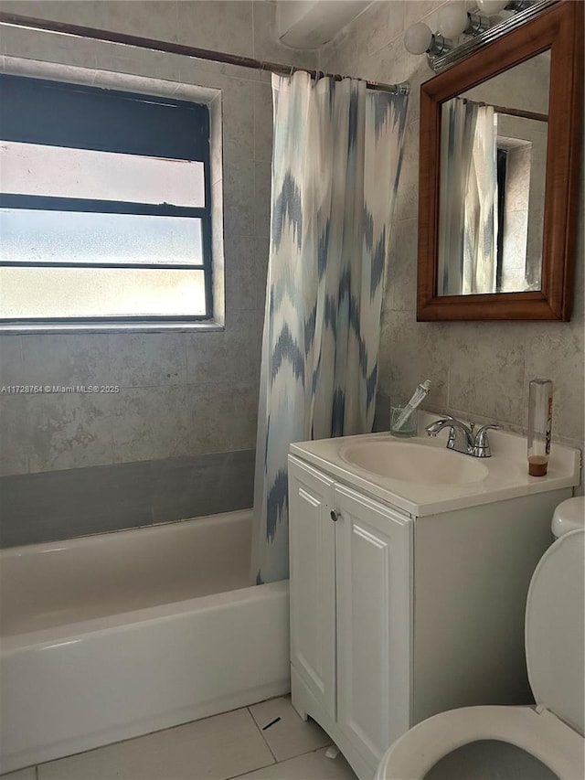 full bathroom featuring tile patterned floors, vanity, shower / tub combo, and toilet