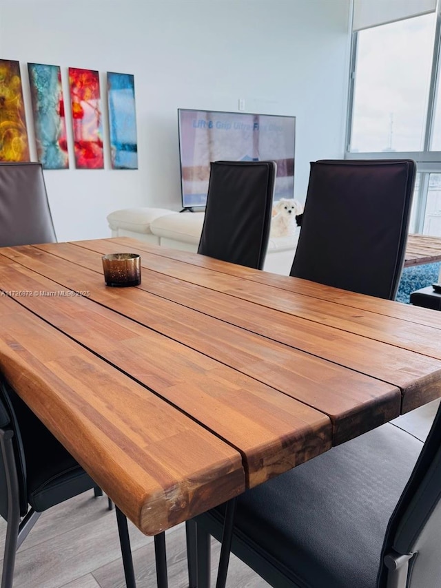 dining area with light hardwood / wood-style floors