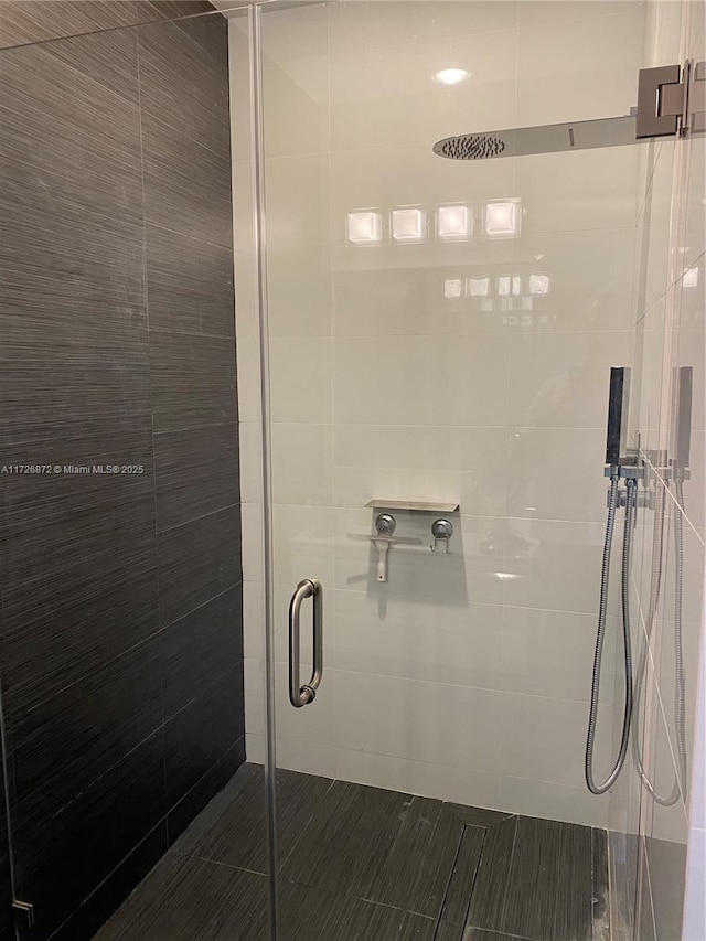 bathroom with an enclosed shower