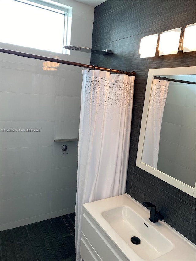 bathroom with vanity and a shower with shower curtain