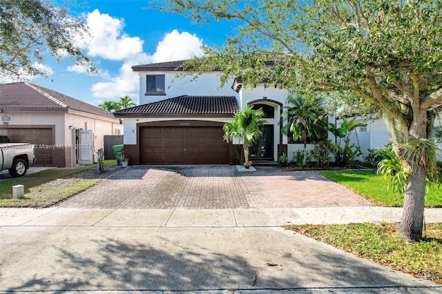 mediterranean / spanish-style home featuring a garage