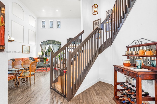 stairs featuring hardwood / wood-style flooring