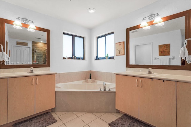 bathroom featuring tile patterned flooring, separate shower and tub, and vanity