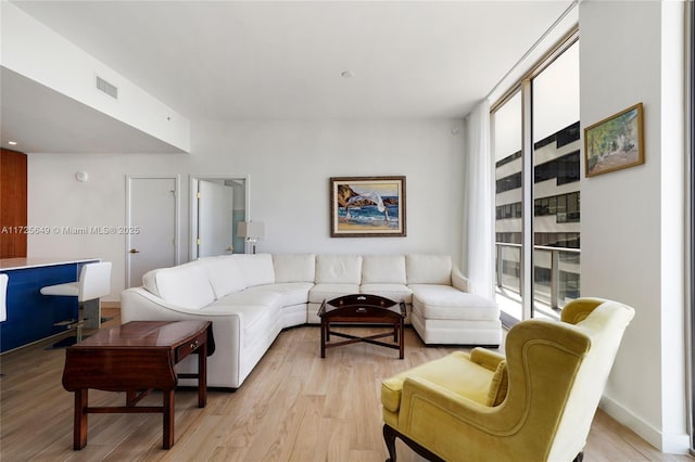 living room with light hardwood / wood-style floors