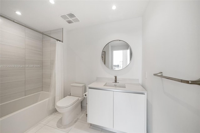 full bathroom featuring tile patterned flooring, toilet, vanity, and shower / bath combination with curtain