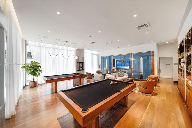 recreation room with light hardwood / wood-style floors and pool table