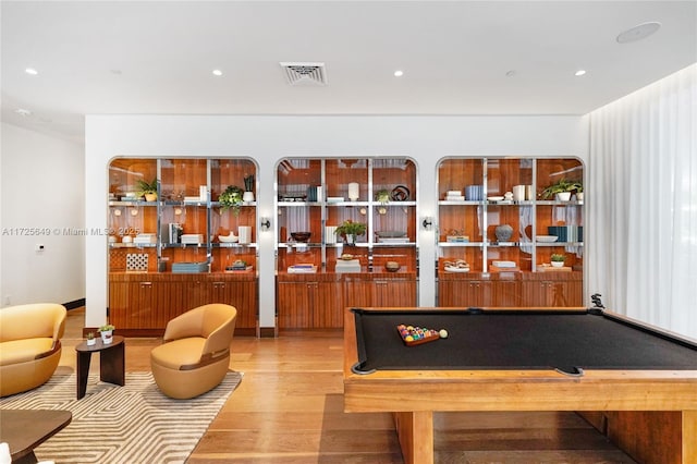 playroom featuring wood-type flooring and pool table