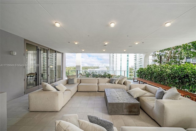 living room featuring a wall of windows