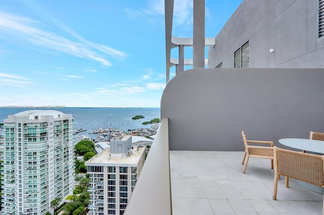 balcony featuring a water view