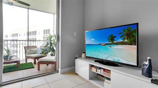 living room featuring ceiling fan and light tile patterned floors