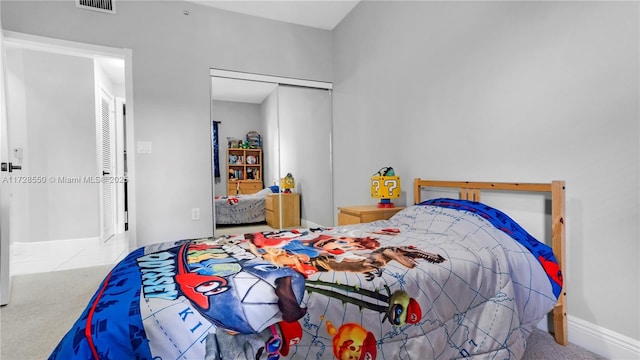 carpeted bedroom with a closet