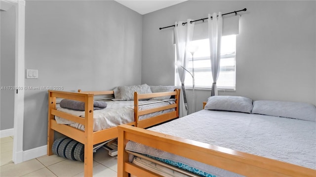 bedroom featuring light tile patterned floors