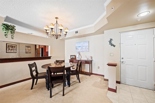 dining room featuring visible vents, light carpet, baseboards, a textured ceiling, and a notable chandelier