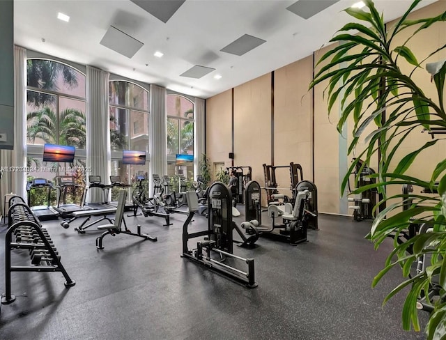 gym featuring recessed lighting and floor to ceiling windows