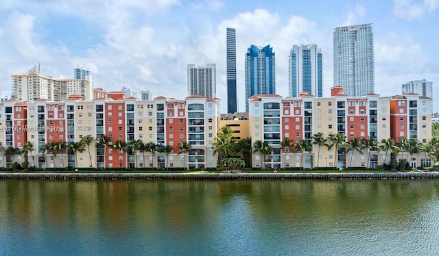 exterior space with a city view and a water view