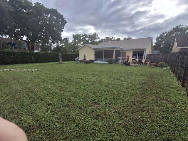 view of yard with a sunroom