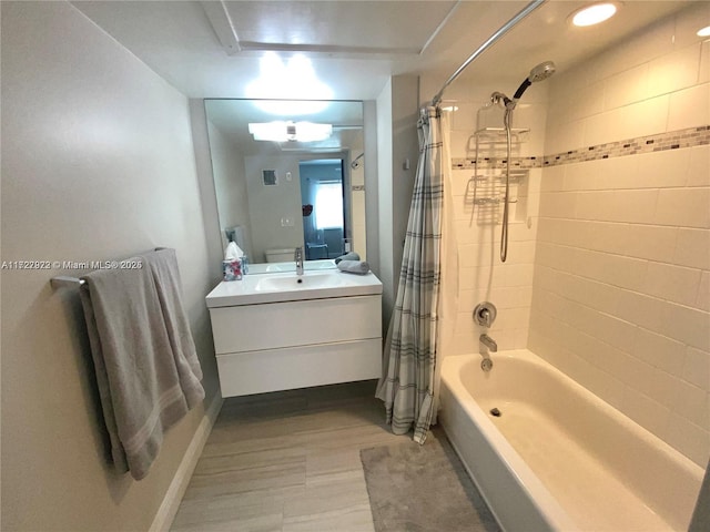 bathroom with shower / bath combo and vanity