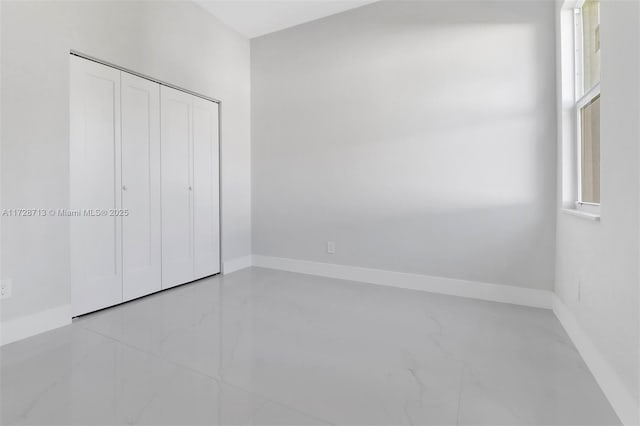 unfurnished bedroom featuring a closet