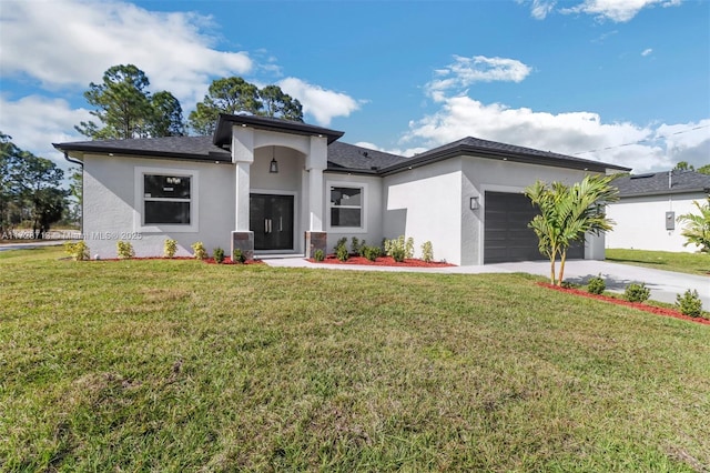 view of front of property with a front yard and a garage